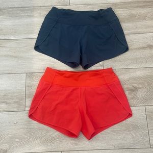 2 pairs of CRZ yoga mid rise 4 inch running shorts